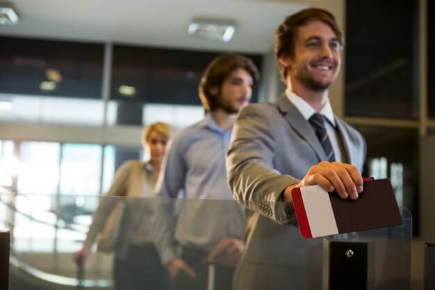 businessman-standing-with-boarding-pass-check-counter_107420-63615 (1)